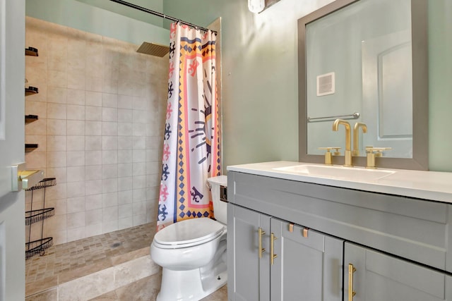 bathroom featuring a shower with curtain, vanity, and toilet