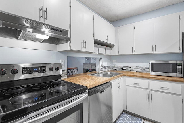 kitchen with a textured ceiling, white cabinetry, sink, and stainless steel appliances