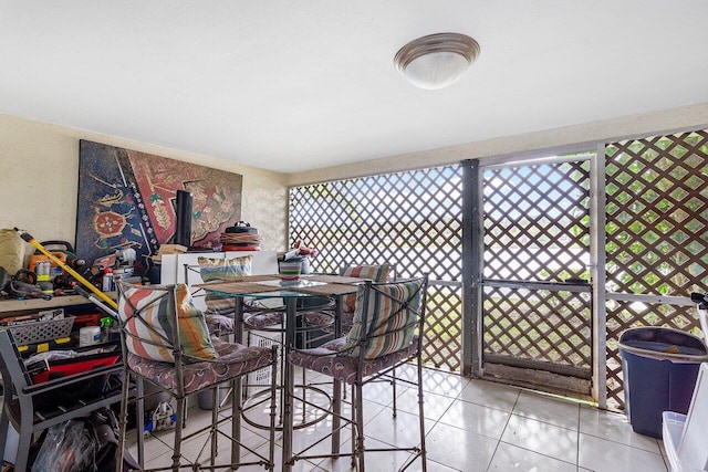 dining area featuring light tile patterned floors