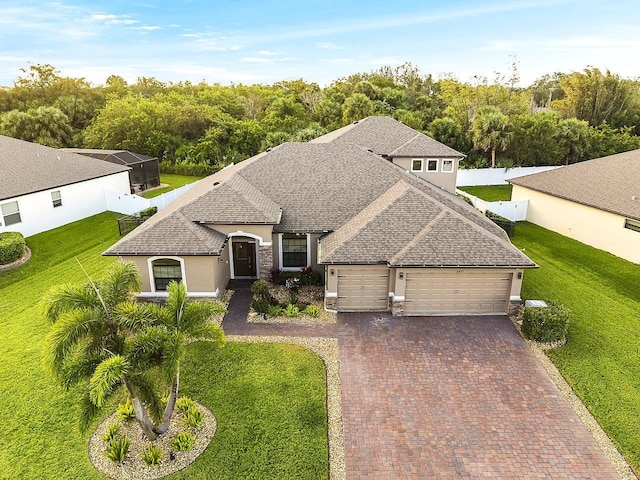 view of front of house with a front lawn and a garage