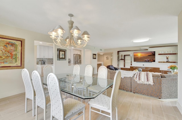 20100 Boca W Dr Unit 125, Boca Raton, FL 33434 - dining area with a chandelier, wood tiled floors, and baseboards