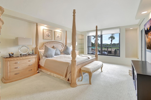 bedroom featuring light carpet