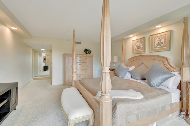 bedroom featuring light colored carpet