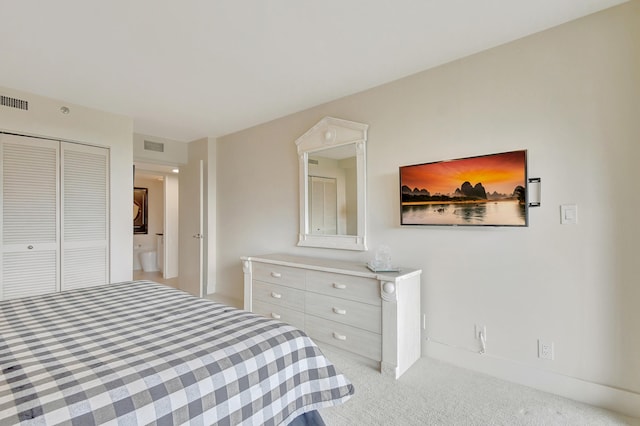 carpeted bedroom featuring a closet