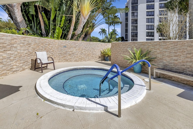 20100 Boca W Dr Unit 125, Boca Raton, FL 33434 - view of pool featuring a fenced backyard, a hot tub, and a patio area