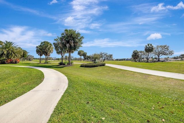 view of property's community with a lawn