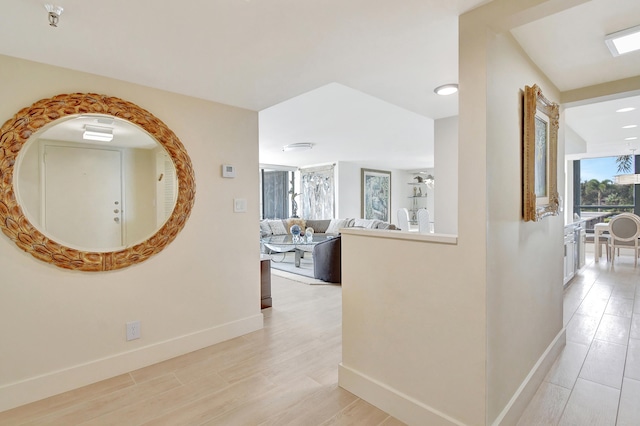 hall with light hardwood / wood-style floors