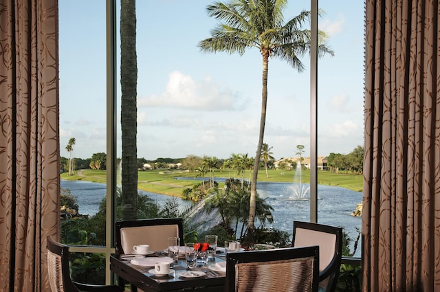 20100 Boca W Dr Unit 125, Boca Raton, FL 33434 - sunroom / solarium featuring healthy amount of natural light, view of golf course, and a water view