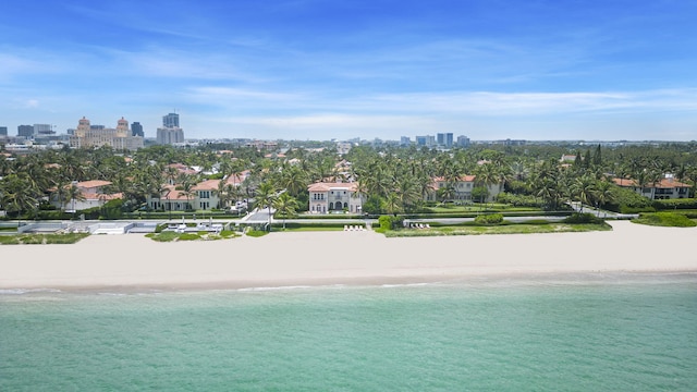 view of pool featuring a beach view and a water view