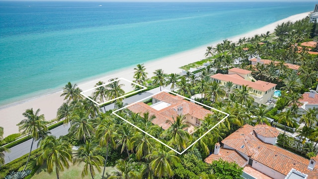 aerial view with a view of the beach and a water view