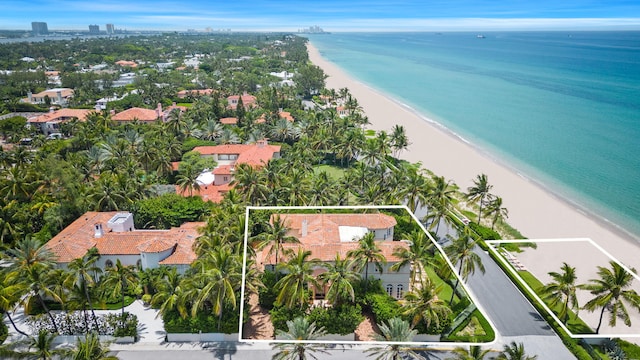 bird's eye view featuring a view of the beach and a water view