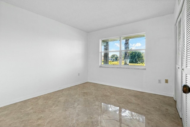 unfurnished bedroom featuring a textured ceiling