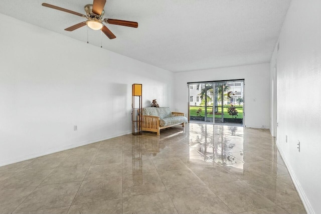 unfurnished bedroom featuring a textured ceiling and ceiling fan