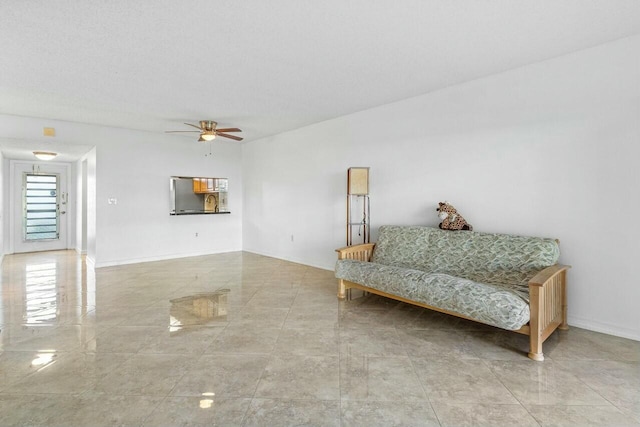 sitting room with ceiling fan