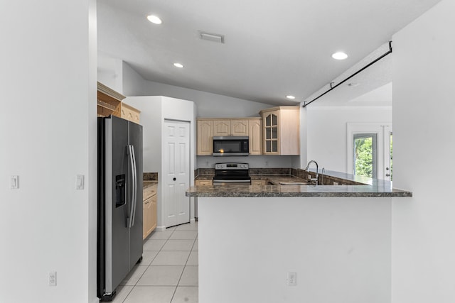 kitchen featuring sink, light brown cabinets, kitchen peninsula, light tile patterned floors, and appliances with stainless steel finishes