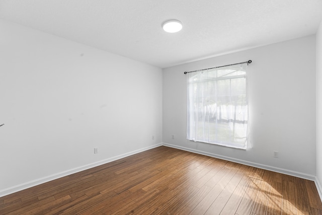 spare room featuring hardwood / wood-style flooring