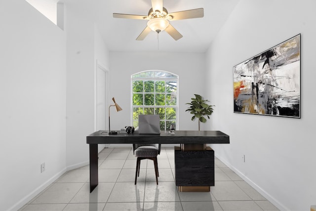 home office with light tile patterned floors and ceiling fan