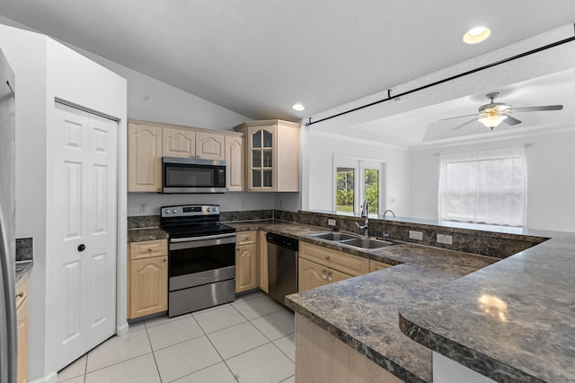 kitchen featuring kitchen peninsula, appliances with stainless steel finishes, sink, light brown cabinets, and light tile patterned floors