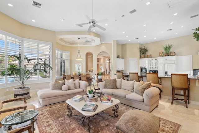 living room featuring ceiling fan and light tile patterned floors