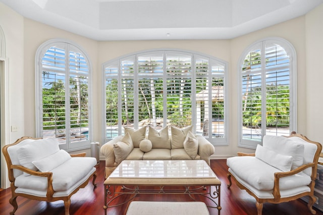 sunroom / solarium with a tray ceiling and plenty of natural light