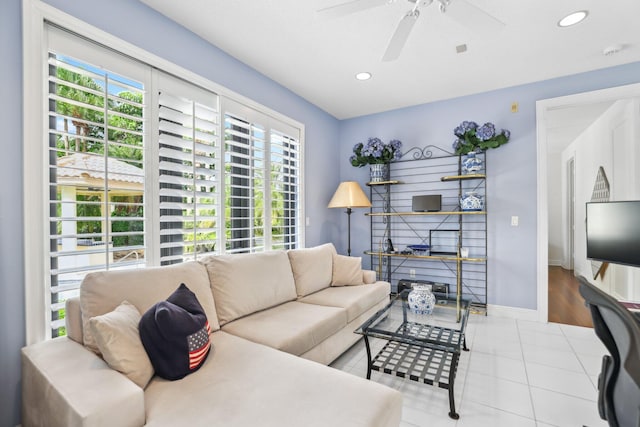 living room featuring ceiling fan and light wood-type flooring