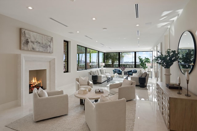 living room featuring a high end fireplace