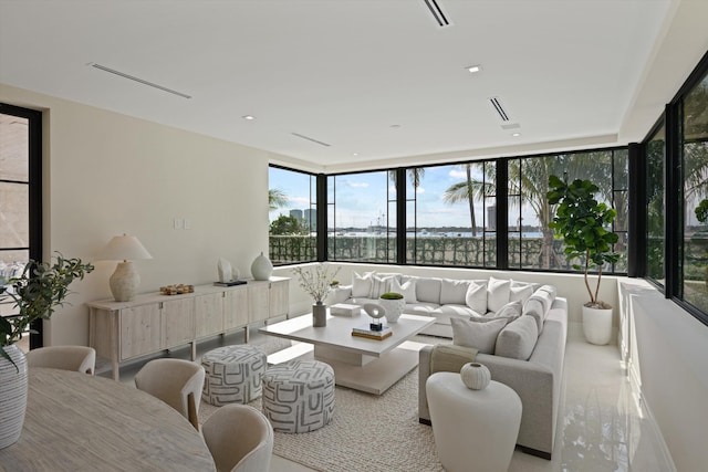 living room with floor to ceiling windows