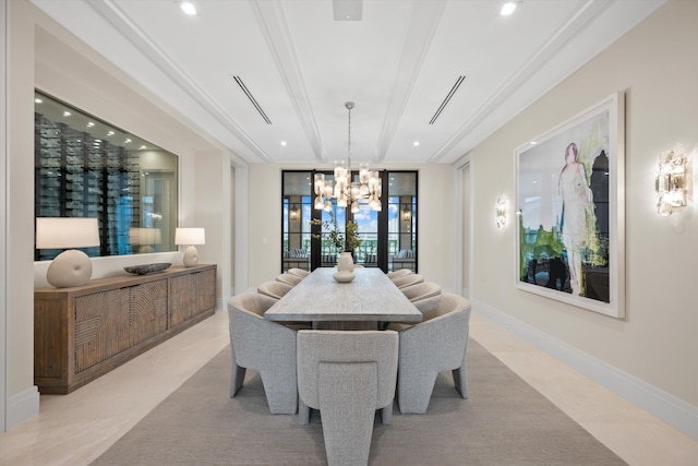 dining room with a chandelier and crown molding