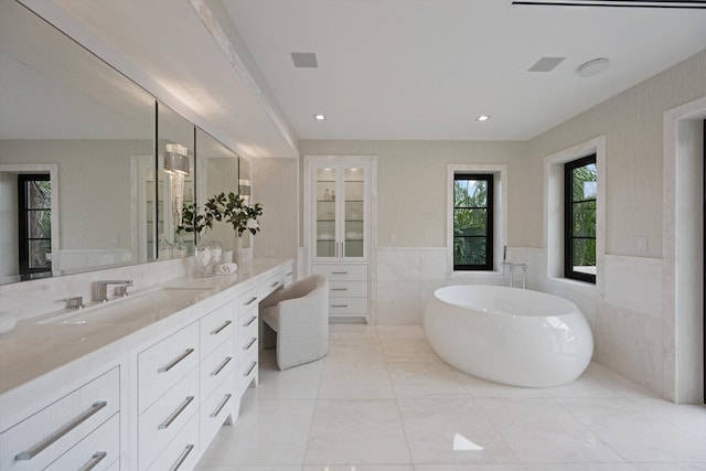 bathroom with vanity and a bathtub