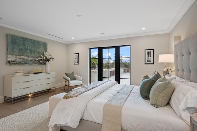 bedroom featuring dark wood-type flooring, access to outside, french doors, and crown molding