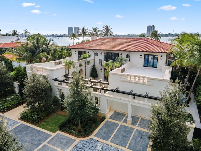 back of house featuring a water view