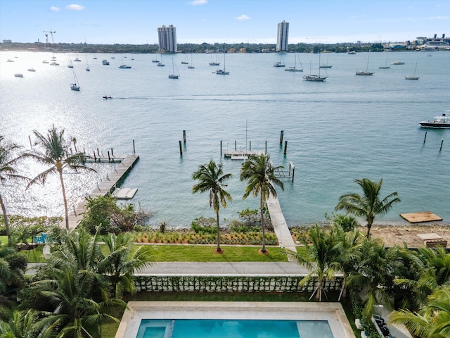 exterior space with a water view and a boat dock