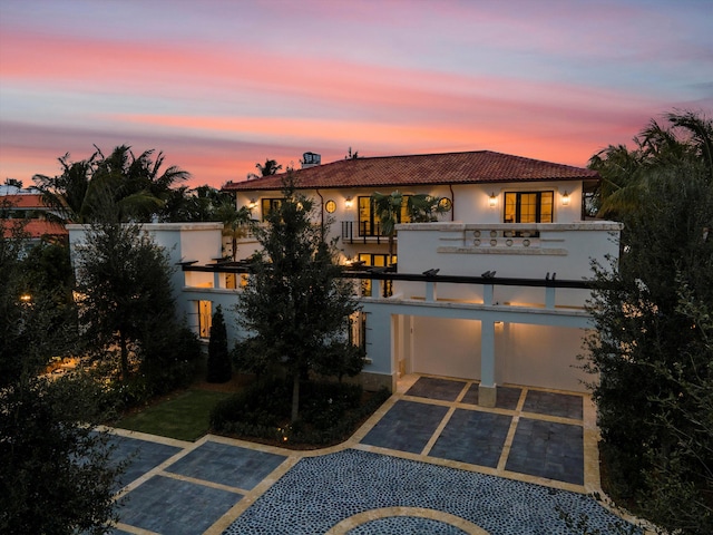 view of front of home featuring a balcony