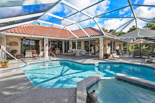 view of swimming pool featuring an outdoor living space, ceiling fan, glass enclosure, and a patio area