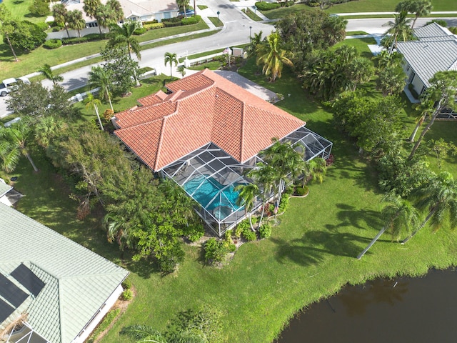 birds eye view of property with a water view