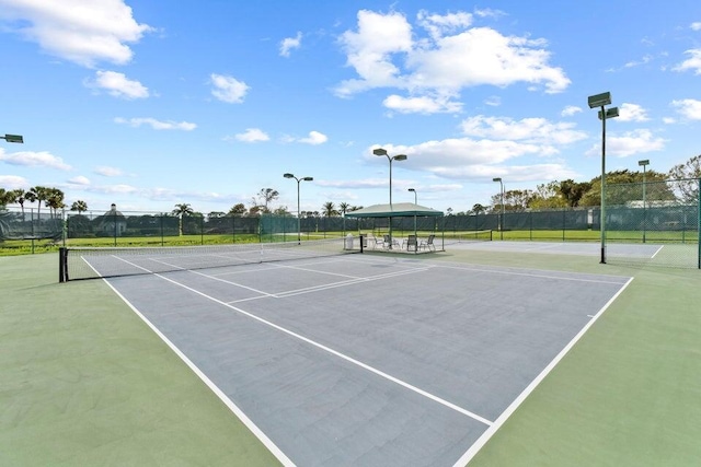 view of sport court with fence