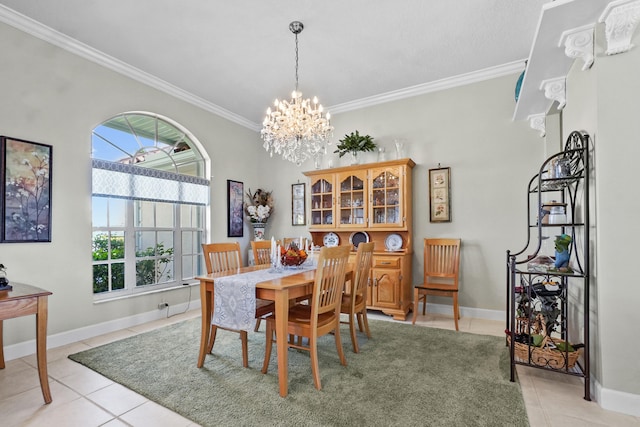 dining area featuring a notable chandelier, light tile patterned floors, and ornamental molding