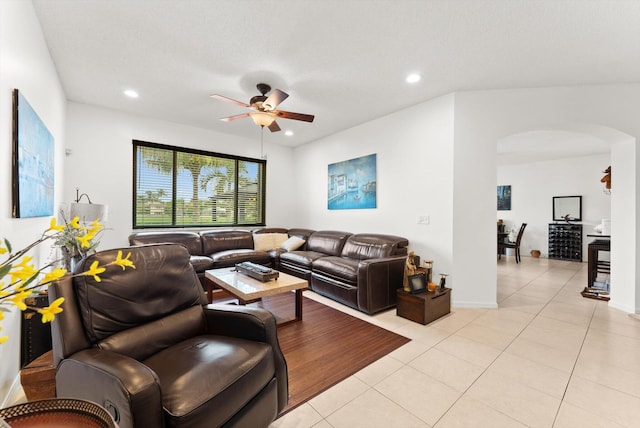 living room with ceiling fan and light tile patterned floors