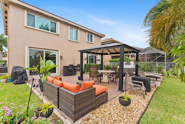 rear view of house with a gazebo, a patio area, an outdoor living space, and a lawn