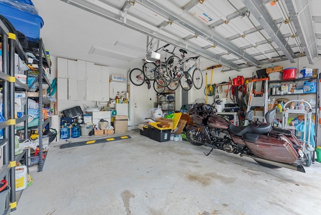 garage featuring a garage door opener