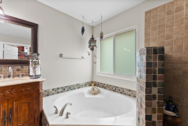 bathroom with vanity and a bathtub