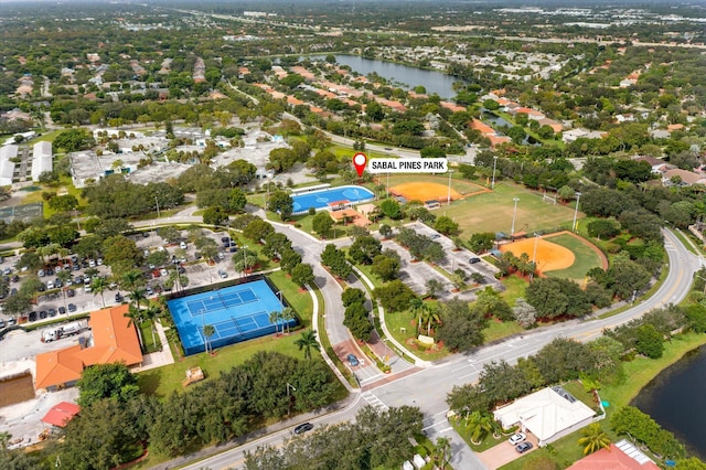 birds eye view of property with a water view