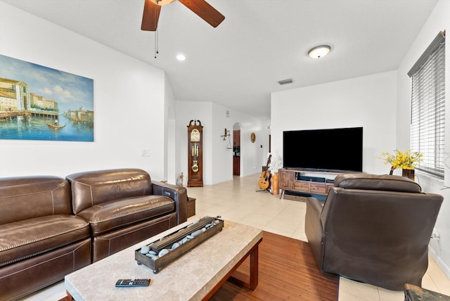 living room featuring ceiling fan and hardwood / wood-style flooring