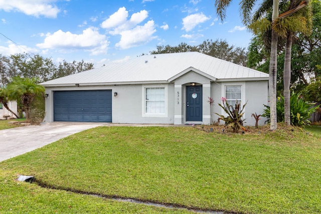 ranch-style home with a garage and a front yard