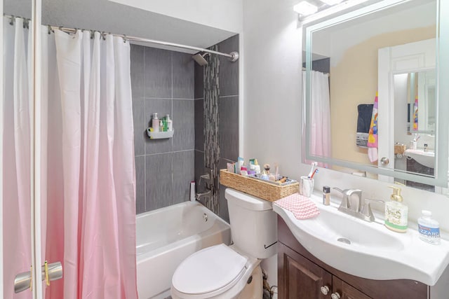 full bathroom with shower / bath combo, vanity, and toilet