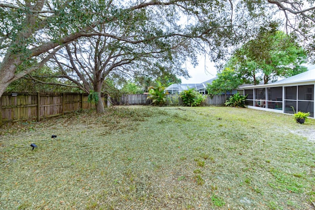 view of yard with a sunroom