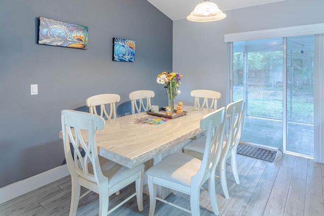 dining area with wood-type flooring