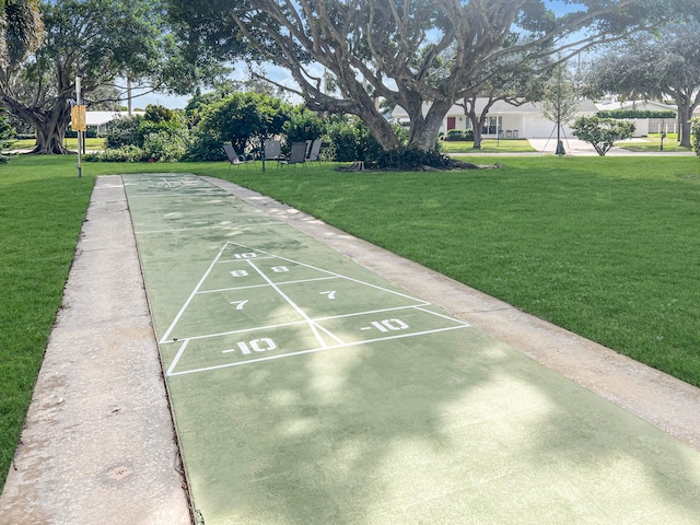 surrounding community featuring a lawn