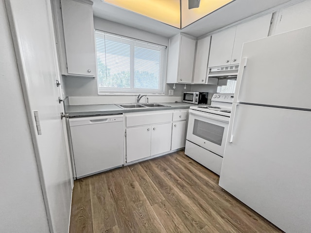 kitchen with white appliances, a sink, white cabinetry, and under cabinet range hood