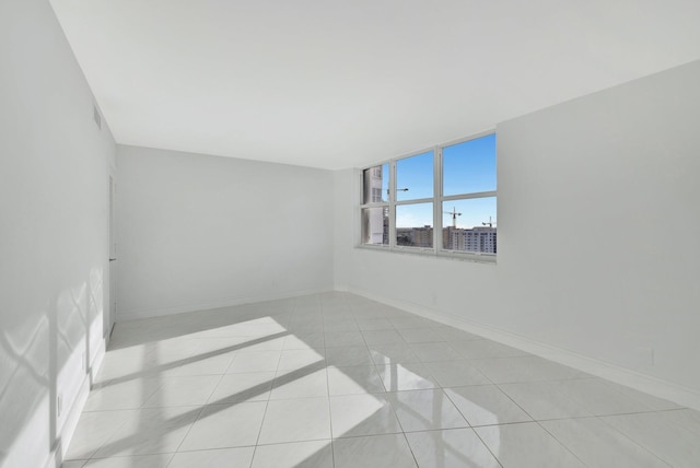 empty room with light tile patterned floors